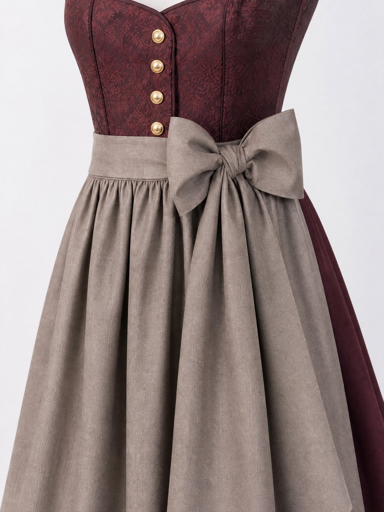Dirndl Carolin in Weinrot mit Taupe Schürze - Detailansicht Taille und Schleife